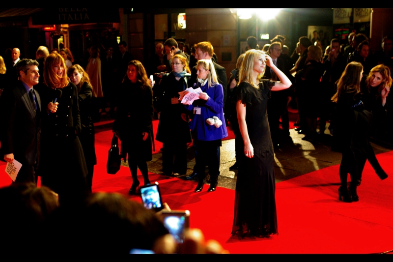 Cute girl in blue/purple jacket holds papers. Also.. Clare Daines is on the red carpet and she's the lead actress in this film.
