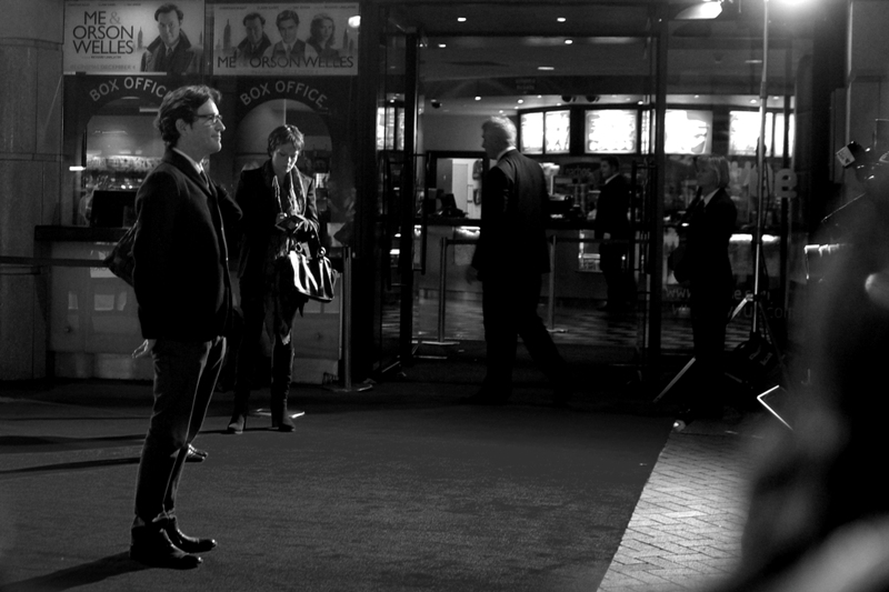 This may be Ben Chaplin, and if so : he's in the film. Or he could be one of the geeks from the sitcom 'The Big Bang Theory'. Either way, he also has a curiously forward leaning pose. (How's the 'cute blonde purple/blue jacket wearing girl count going?', I hear you ask?)