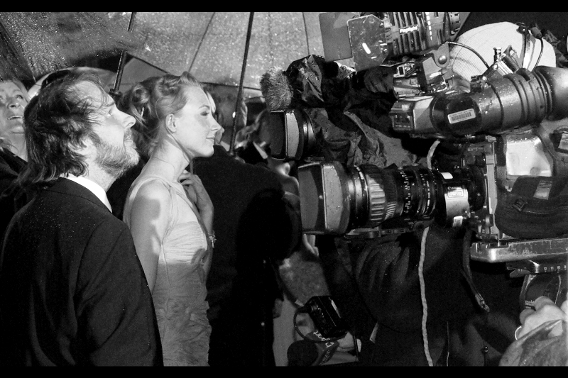 Director Peter Jackson and Actress Saoirse Ronan admire the rain and the heavy camera machinery pointed at them