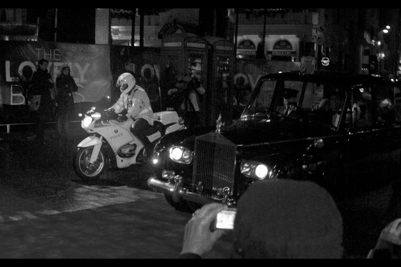 It's a car. It's impressive. It has a police entourage. (I travel by tube and wear a dark beanie.. that's how you travel incognito)
