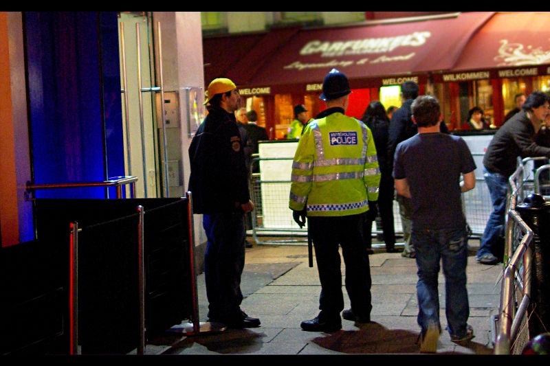 The famous Yellow Cap Guy getting interviewed by The Fuzz?? No, Yellow Cap Guy! Get to your spot!!