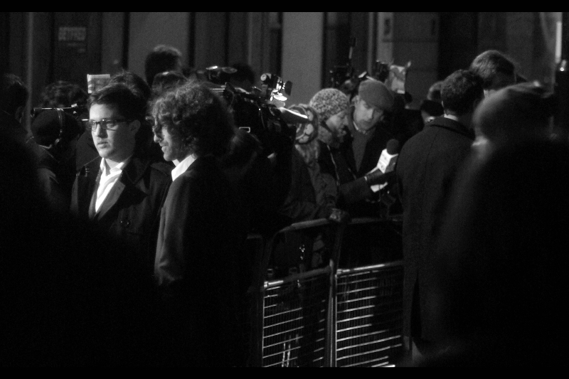 All I know is that the guys on the left are not from the band Blur, so I'm calling them the Wachowski brothers, who directed The Matrix trilogy, regardless of how implausible their attendance would be.