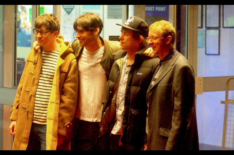 From my notes of the night: "Guy with stripey t-shirt and cartoony coat and glasses; Guy who looks strangely younger than the rest of the band; Friendly Guy carrying green bottle of possibly alcoholic liquid throughout the premeire; and Their Accountant Friend" (Again, in my defence, I'm from Australia)