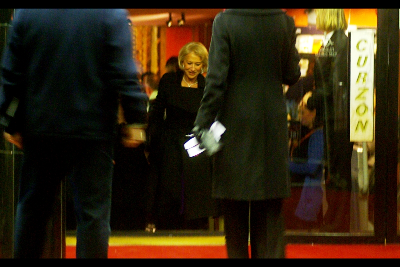 Dame Helen Mirren returns, as promised, to sign some autographs. The premiere took place at a cinema with a front entrance that opened onto a two-way street only one side of which was closed to traffic, so they moved autograph-hunting fans across the road to her immediate left. They don’t really do that sort of thing for James Cameron films, I’m told.