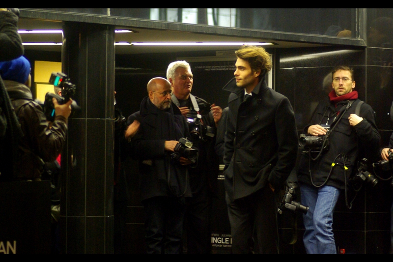Holy carp. Is he one of the incidental actors from the hateful ‘Twilight’ films? Or some Romanian count seeking a British bride? Perhaps, and/or who cares... but I will profess at guffawing at the recoil from the simply *awestruck* photographer in the background to the right.