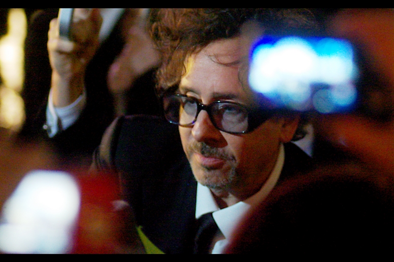 Tim Burton, shot around overlapping fans, their mobile phones, their point-and-shoots, their umbrellas, their autograph books and the rain. (They don't give out medals or knighthoods for civilian premiere photography, sadly.)