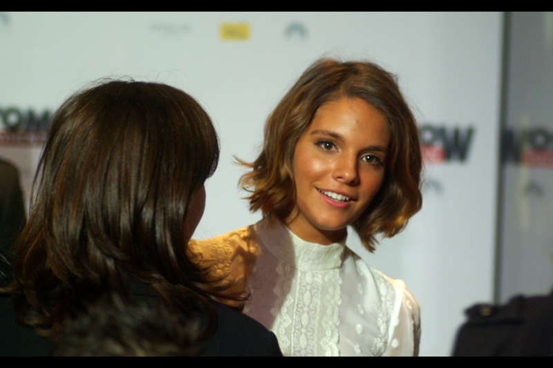 This is actress Caitlin Stasey. She's in the film, and has previously been in five episodes of 'Neighbours' and played 'herself' in the 49th annual Logie Awards. (Is that even a legitimate screen credit??)