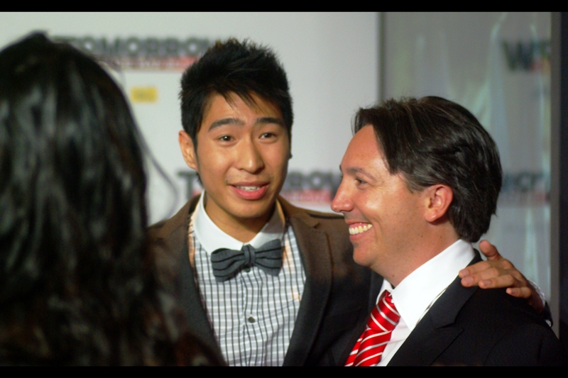This is/may be Chris Pang, whose bow tie clearly implies he knows that ice, being less dense than water, would float if you blew up an arctic base. Oh, dear lord, the director also wrote the screenplay for the third Pirates of the Caribbean film. That one made no sense either.. .