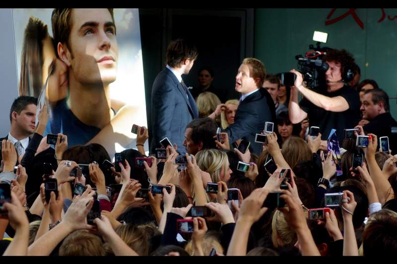 "Could you sign something... anything.... for my daughter... PLEASE? Here, sign my cameraman!!!"