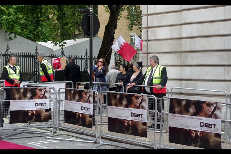 Kind of weirdly, this premiere also came with its own adjoining protesters shouting and chanting at the embassy across the road (I think it was the Saudi Arabian embassy, and the flag they're waving is either Bahrain or Qatar (I think?))