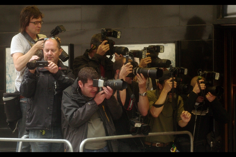 Man on left : "Ooh - Look! A bug. I'll shoot that instead - the agency will be thrilled"