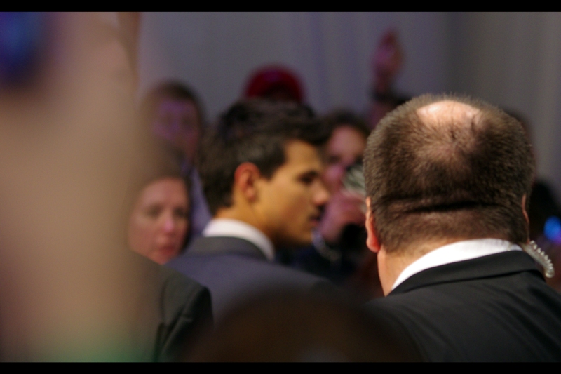 Things go from bad to worse - here's my only shot of Taylor Lautner zipping past. (Oh, and some security guard's neck fat, if you're a fan of that).