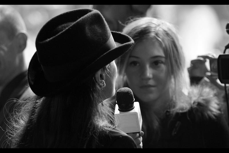 Cute interview girl asks "where do you get a hat like that?"