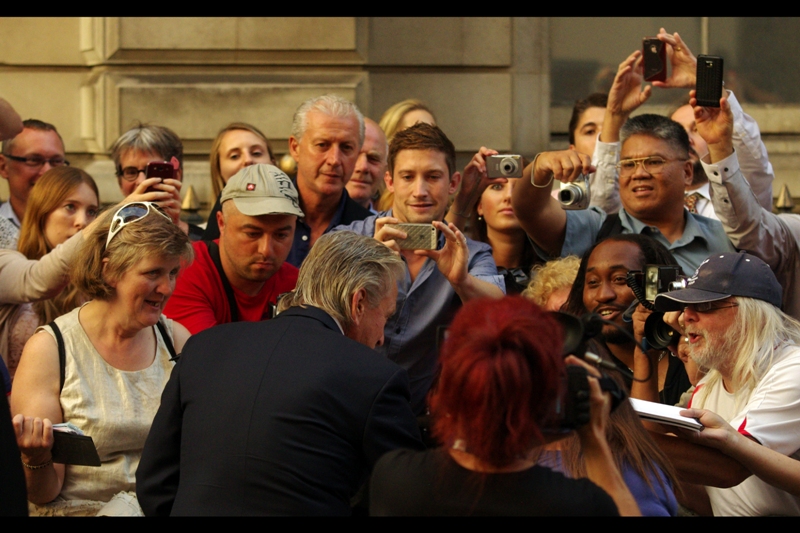 Michael Douglas signs autographs. Very cool. Also, he ended up winning the *Legend* award. I'm not a fan of the titles and categories GQ bestows (refer Emma Watson, below), but I'm not going to argue with Michael Douglas.