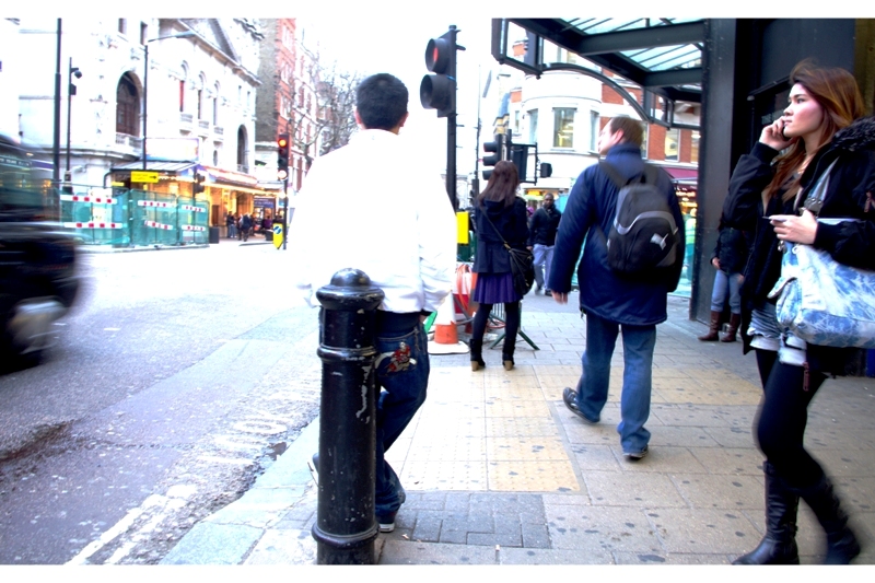 I completely forgot why I forgot why I even took this photo. Was the girl in on the right pretty enough? Was the motion blur on her and the guy a contrapoint against the moving taxi on the right? No... turns out it was the superhero patch on the back pocket of the guy leaning against the bollard. Plus I like the word 'bollard'