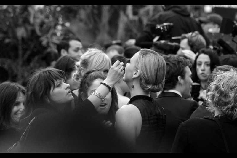 "A cornea transplant? Here? Now? Okay, then..." Charlize Theron gets a makeup change (?)