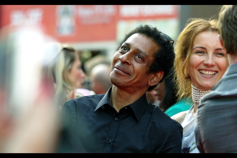 The lady on the right is Natalie Press, who (unlike so many) is actually in this film. The dude on the left has an awesomely expressive face in every photo I took, but I don't know if he's in the movie. If he's a random street performer / interloper, then Well Played, Sir