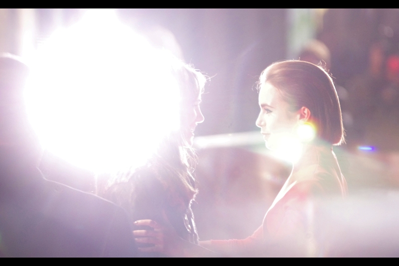 "I have been... and always shall be... your friend" Suki Waterhouse and Lily Collins stand in front of the Paparazzi and the resulting cacophony of flashbulbs puts most nightclubs in London out of business.