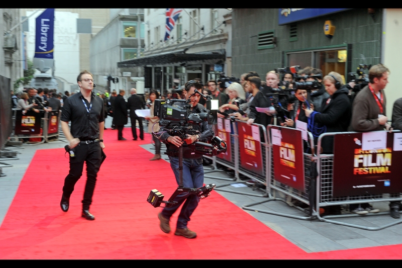 Meanwhile, this is not a battle suit for Elysium or Edge of Tomorrow constituting a 4th/5th simultaneous premiere, but rather a BBC cameraman with a counter-weighted, gymbal-stabilised, waist-mounted, possibly-also-cup-holder-included camera rig. And to think, I still use two hands to hold my camera. Or one if I'm feeling particularly adventurous.