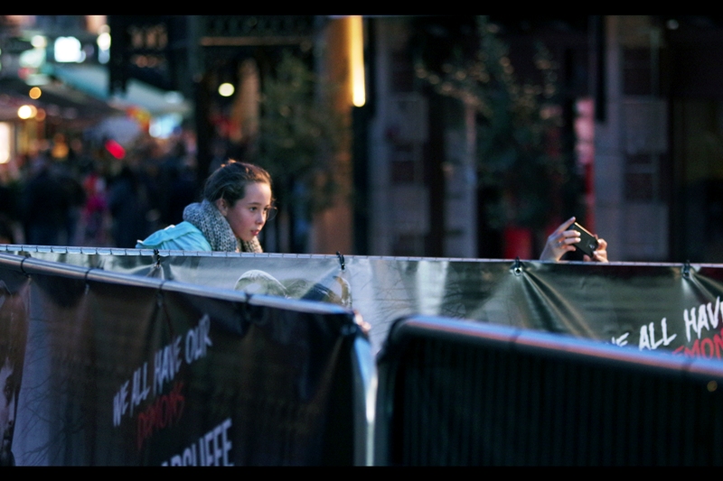 This is technically an illegal move at a premiere. The unspoken rule is that you can't (a) touch the 2m high exclusion fence, or (b) stand where you'd obstruct through-traffic. Then again, security at these things are hired less for their ability to succinctly convey a policy than kind of growling at you to Get Down From There. So... you've been warned.