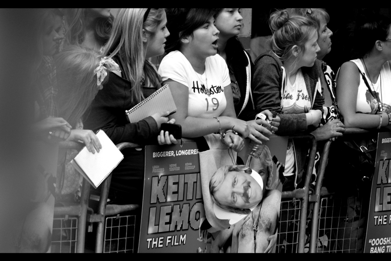 I hate Keith Lemon / Leigh Francis to a degree that is irrational but nonetheless sincere (see also : Matthew Broderick). So I don't want to be here, but I am. And my intention is to avoid photographing him if I can. Yes. I know. He's the lead actor, star, and character. _But I can try._ ps. A facemask is not the real thing. Also : I'm going black'n'white for this whole journal to lend the event a sense of class it couldn't otherwise achieve.
