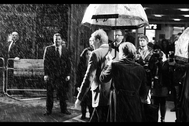 "It's the kind of weather that needs a supermuscle-y dude in a breathing mask to rip a cowl off a dude who quit crimefighting for eight years. But sure, I'll pose for ya" . That's a reference to the trailer of Christopher Nolan's 'The Dark Knight Rises' on the off-chance you're reading this years later, in the future.