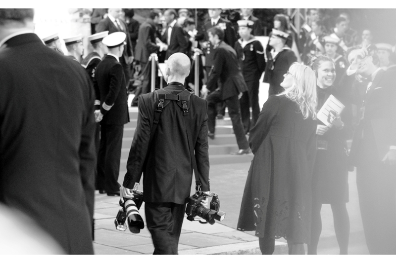 One day, when I'm slightly older and only slightly balder, I want to be this guy. He's wearing a RESTRAINT on his cameras. Farq! (I'll just keep risking scoleosis by standing here with mine hanging over one shoulder...)