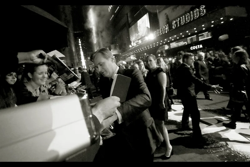 Christopher Nolan has chosen a spot about three to my left to start signing autographs, and heading in a direction moving AWAY from me.....ARGH. Incredibly, after getting his Inception suitcase signed by the Director, Mo (my Sensei and Guide) grabbed my Moleskin and reached across to Chris Nolan, but it was to no avail. Argh.