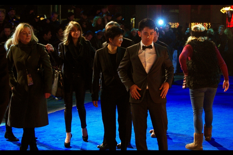 We shared a moment, but I still prefer Kristen Stewart. He's Ang Lee's son. The woman to the right of him with the headband and vest, though? Is a fashion abomination.