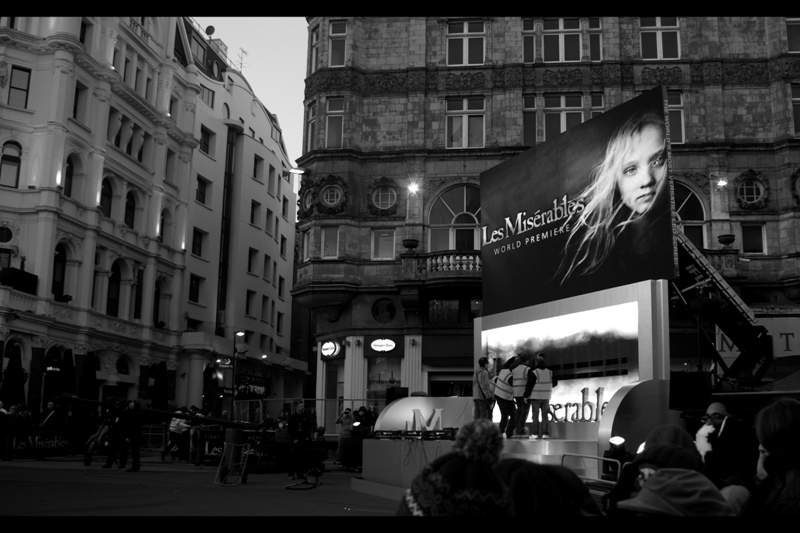 It's Les Miz - it's a musical, but fairly popular. I'm surprised they didn't get Baz Luhrman to direct it, but for now I'm just happy that they're not playing the trailer noisily every few minutes for two hours. I'm listening to The Dark Knight Rises soundtrack. It doesn't fit.