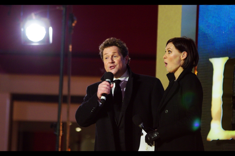 The host on the left apparently played the character of 'Marius' in the original stage version of the show 27 years ago. The woman on the right just figured out that he's been lying about his age. (?)