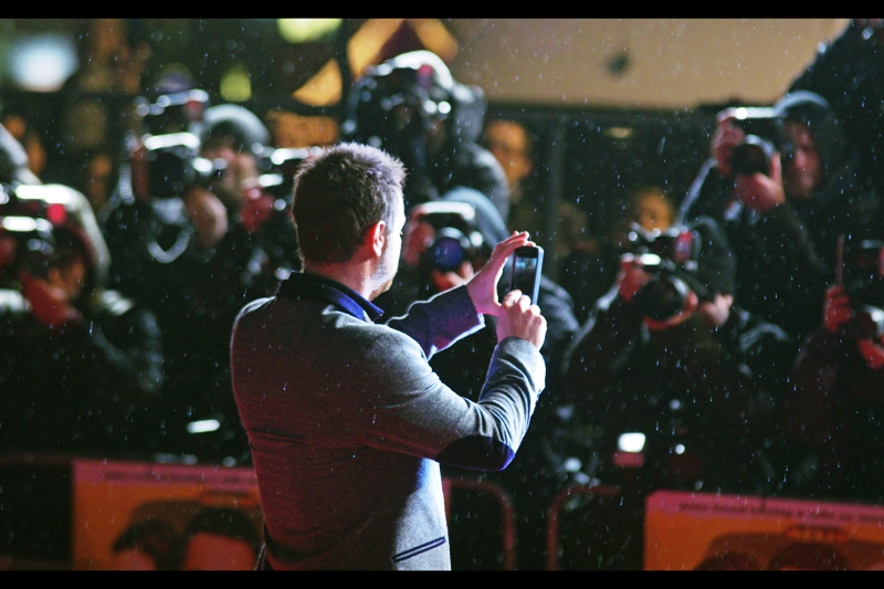 Third on the poster, and also now newly arrived is Danny Dyer who is best known (to me) as ' guy who insouciantly flicked a cigarette at the premiere of "Malice In Wonderland" in 2010 '. Now he's taking photos on an iPhone. We all move on.