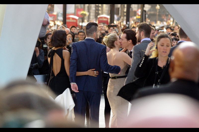 Benedict Cumberbatch arrives to the sound of a thousand urgently excitable female cheers, and promptly kisses Alice Eve. Well.... damnit. What the hell has he got that I don't? (Or more to the point, what other than two DSLRs and a website not run by my fans do I have that HE doesn't)