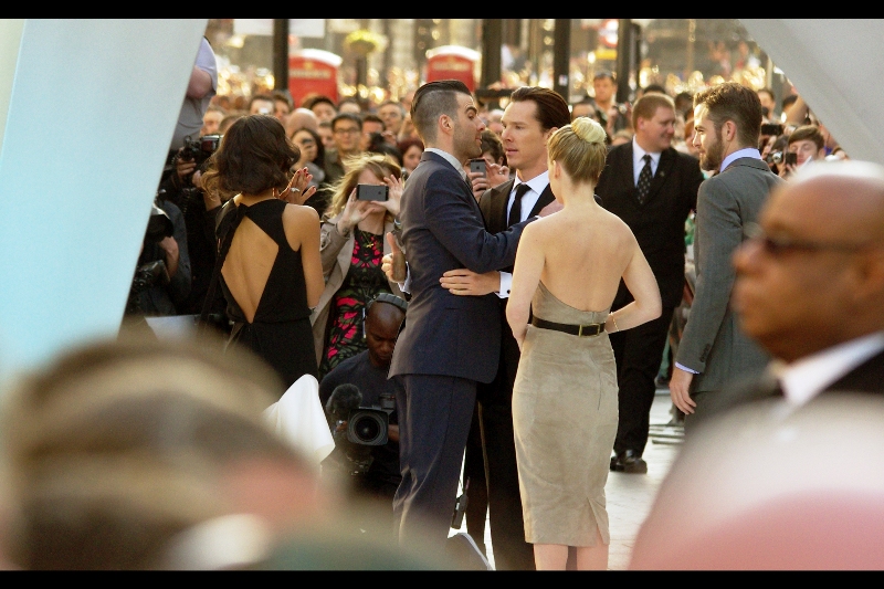 Benedict Cumberbatch then kisses Zachary Quinto and the randomness/ awesomeness quotient of this premiere just burst past the "Iron Man3" premiere from two weeks ago . And Robert Downey Jnr stole somebody's KID at that premiere.