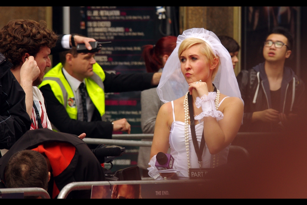 One hour to go, and Reporter Lady has just realised that her plans to successfully propose marriage to Bradley Cooper will be undone if just one journalist in a wedding dress gets to him at the hotel first. (Also, I think she's the same lady who dressed as Princess Leia at the Star Trek Into Darkness premiere a few weeks back)