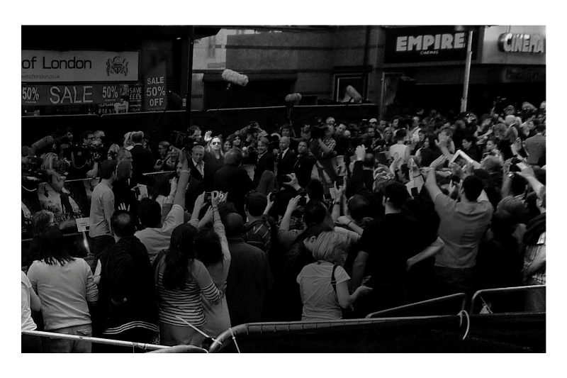 Bearing in mind I can not see what I am shooting, I am effectively like those deep sea bathyscapes they send down into ocean trenches with a camera pointing out of one window, hoping that something interesting will swim past and not be blurry. Thus, I am pleased (and very surprised) to present a photo of Brad Pitt, waving. (I had to both mono- and darken this shot a little aggressively so he stood out - people were wearing too many colours and shades at the event!).