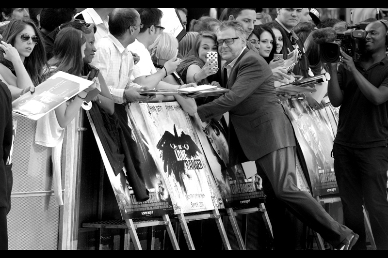 I don't know who this is. From the back I thought "Tom Wilkinson" but he's never this jolly.