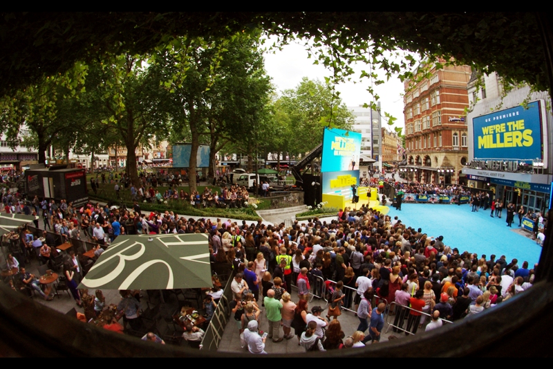 This is the view a pint of Aspall's and a small plate of fries will buy you at this premiere, as photographed on a fisheye lens. The majority of the crowd is a giant heaving mass in front of me, but a column at least four deep, plus a row of media across from them, stretches from the right part of this picture all the way to the road a further thirty meters or so away.