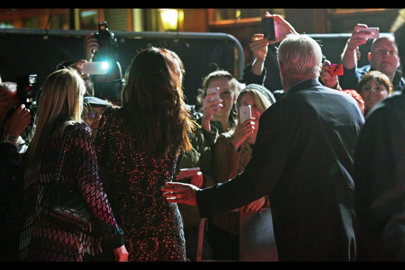 Sandra Bullock's security dude has a choice of beating up five girls and a guy who are photographing her, or leading her away from danger. I think he tightened his grip on the baseball bat he was holding, but elected to move Ms Bullock back to the media pen. (Actually, he seemed nice. And he's not standing over me with a baseball bat as I'm typing this)