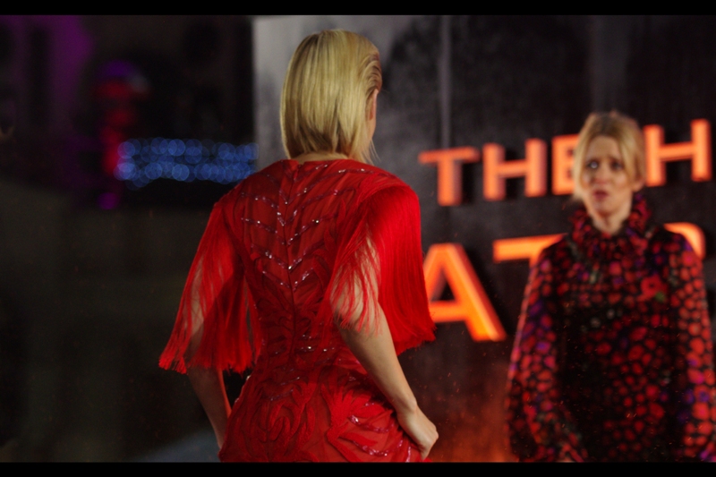 What dress through yonder stage cometh? It is.... red. And feathery.