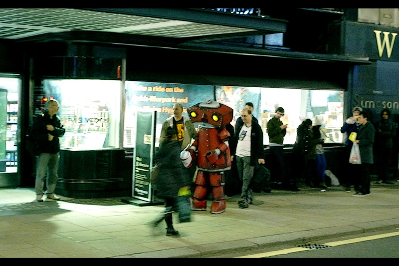 Apparently the guy in the robot suit has been in line since noon and hasn't stopped for a toilet break. And he's carrying a large-capacity Big Gulp container. (I decided not to ask whether it was in the process of being emptied or filled).
