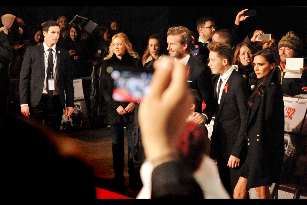 Posh, Becks and Offspring of various sizes. With big thanks to the person holding up the camera in front of me. Not because they have no right to (they do), but because I believe their picture isn't in focus and they probably ARE going to need a flash in that light and at that distance. Mrs Beckham, as a designer / model / performer, has an expression that's on my side, clearly.