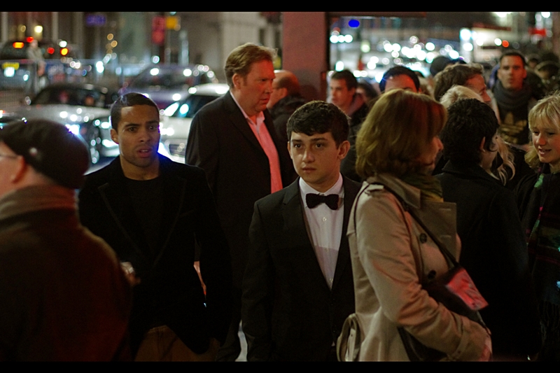 When I last photographed him at a GQ and possibly a prior Empire Awards, I had no idea who he was. I still don't. But he's the one wearing the tuxedo, not me, so I think it's clear where blame falls. (edited to add : actor Craig Roberts?)