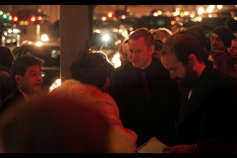 I don't know who th is is, but I suspect the person in the white furry coat is who I'm meant to be photographing. I don't usually broadcast my failures like this, but in a sense I'm at least getting the hang of autofocusing in low light.