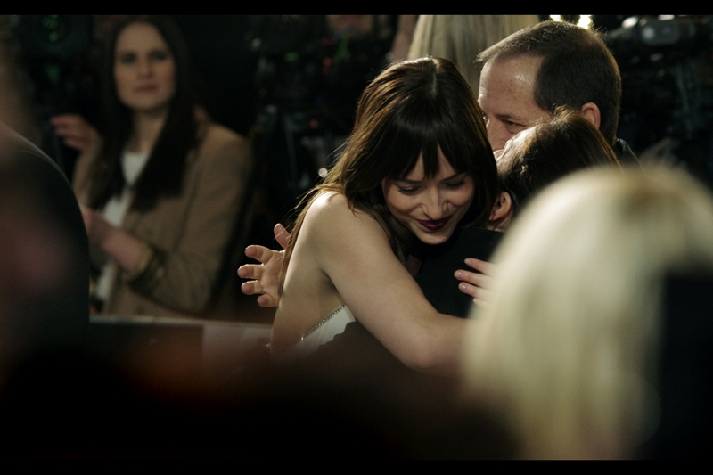 "I don't know who you are, but it's freezing and you're wearing a coat. I'm going to ride this hug for a bit longer" . The weather was a balmy 4 or 5 degrees celsius in London for this premiere.