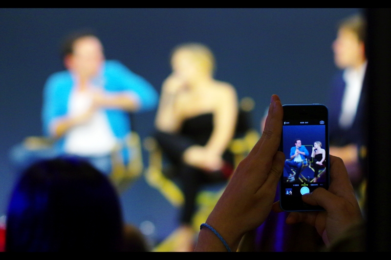 Every time I'm at an Apple Store event, whether it's standing or sitting, in the middle or on the sides, somebody with a giant semicircular head blocks part of my view. This person with their iPhone does not have that difficulty. Oh, well.
