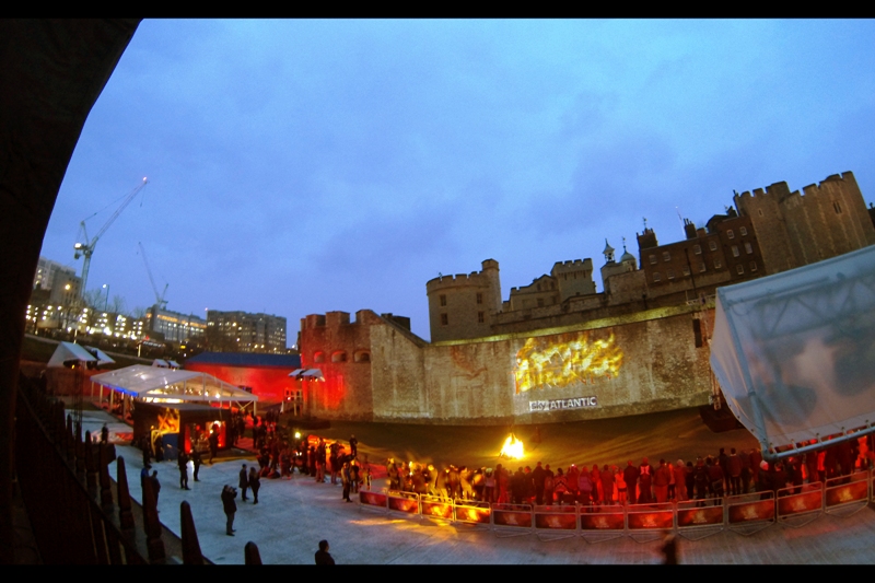 The large pen below was for ticket-holders and competition winners only. Worse, rather than start the premiere when it was still light, they'd scheduled it for an hour after this, when it was definitively dark. Still... gotta respect the dragon/flames mural being projected onto Her Majestry's Tower and Fortress.