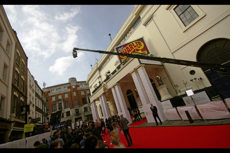 My spot is adjacent to the interview media pen, and there's a giant boom-operated camera that does low passes just over my head. However nobody in my immediate vicinity looks like they'll maul me to get Benedict Cumberbatch's autograph if he shows up (spoiler : he doesn't)