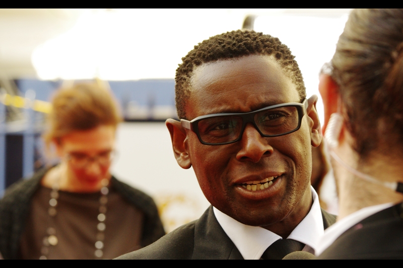 I recognise this man as he was doing interviews directly in front of me at the Olivier Awards a few weeks back , however I don't know his name, and opening Getty Images at home is impossible, and that's because my TalkTalk internet connection hangs by the kind of thread that makes me count down the seconds til I tell those thieving clowns their service sucks since they took over from Virgin. Plus they're charging me more (and claiming they charge me less) because apparently lying is allowed these days? (edited to add : David Harewood)