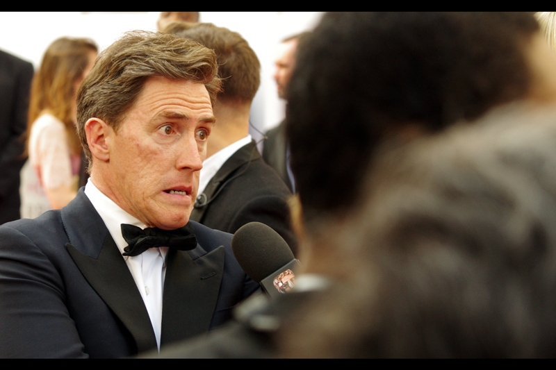 "A hint as to who I am? Well, I'm on television". Thanks. Just like I'm on the internet. (edited to add : Rob Brydon)